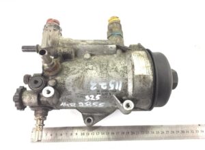 Carcasă filtru de combustibil man 5112501 – stare uzată, cu conexiuni multiple și etichetă metalică